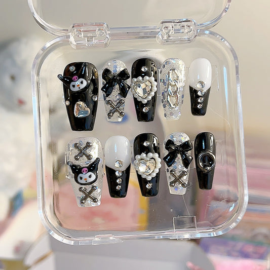 Stylish Black, White, and Silver Kuromi Press-On Nails! Featuring a chic medium coffin shape, these nails showcase a striking combination of minimalist black and sheer white with a stunning silver foil base. The trendy black French tips add a sophisticated touch, making them perfect for any occasion.

Each set is handcrafted and includes a variety of delightful Kuromi charms, including crosses, black bows, sparkling white heart rhinestones, and white pearl hearts, as well as silver chains for an edgy finish